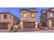 Two-story home with tile roof and a two-car garage at 2376 Switchback Valley St, Las Vegas, NV 89138