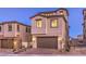 Two-story home with tile roof and a two-car garage at 2376 Switchback Valley St, Las Vegas, NV 89138