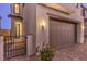 Modern home garage with paver driveway at 2376 Switchback Valley St, Las Vegas, NV 89138