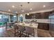 Modern kitchen with island, stainless steel appliances, and white countertops at 2376 Switchback Valley St, Las Vegas, NV 89138