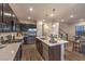 Open concept kitchen with stainless steel appliances and island at 2376 Switchback Valley St, Las Vegas, NV 89138