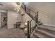 Modern staircase with metal railing and seating area at 2376 Switchback Valley St, Las Vegas, NV 89138