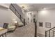 Upstairs hallway with modern light fixture and seating area at 2376 Switchback Valley St, Las Vegas, NV 89138