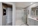 Bathroom with walk-in shower, double vanity, and linen closet at 2844 Alenga St, Henderson, NV 89044