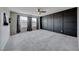 Main bedroom with dark accent wall and plush carpeting at 2844 Alenga St, Henderson, NV 89044