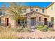 Two-story townhome with stone facade and landscaping at 2844 Alenga St, Henderson, NV 89044