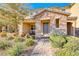 Two-story home with stone exterior and landscaped front yard at 2844 Alenga St, Henderson, NV 89044