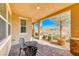 Covered patio with brick flooring and wrought iron furniture at 2844 Alenga St, Henderson, NV 89044