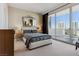 Elegant bedroom with a plush bed and large window at 2857 Paradise Rd # 2203, Las Vegas, NV 89109