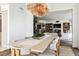 Bright dining room showcasing a long wooden table and unique chandelier at 2857 Paradise Rd # 2203, Las Vegas, NV 89109