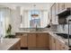 Sleek kitchen featuring marble countertops and light wood cabinets at 2857 Paradise Rd # 2203, Las Vegas, NV 89109