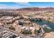 An amazing aerial view of a lakeside community showcasing the building architecture and surrounding landscape at 29 Falling Ridge Ln, Henderson, NV 89011