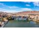 Breathtaking aerial view of Lake Las Vegas bridge apartments and lake against a backdrop of desert mountains at 29 Falling Ridge Ln, Henderson, NV 89011