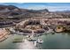 Beautiful aerial view of Lake Las Vegas waterfront properties with docks and boats on the water, under blue sky at 29 Falling Ridge Ln, Henderson, NV 89011