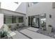 Modern entryway with plants and a glass door at 29 Falling Ridge Ln, Henderson, NV 89011