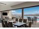 Indoor dining area with access to the outdoor patio and lake views at 29 Falling Ridge Ln, Henderson, NV 89011