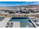 Elevated view of modern home's pool and lake view at 29 Falling Ridge Ln, Henderson, NV 89011