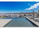 Infinity pool with lounge chairs and breathtaking lake views at 29 Falling Ridge Ln, Henderson, NV 89011