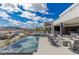 Large infinity pool with fire pit and mountain views at 29 Falling Ridge Ln, Henderson, NV 89011