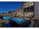 Modern spa and pool area at night; backyard oasis at 29 Falling Ridge Ln, Henderson, NV 89011