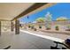 Landscaped backyard with covered patio and seating at 3004 Canton Hills St, Henderson, NV 89052