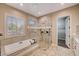 Spa-like bathroom with soaking tub, walk-in shower, and double vanity at 3004 Canton Hills St, Henderson, NV 89052