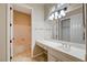 Bathroom with single vanity, mirror, and bathtub at 3004 Canton Hills St, Henderson, NV 89052