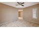 Bright bedroom with ceiling fan, tile floors, and window shutters at 3004 Canton Hills St, Henderson, NV 89052