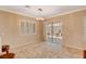 Dining room with tile floors, plantation shutters, and sliding glass doors at 3004 Canton Hills St, Henderson, NV 89052