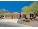 Single-story home with three-car garage, solar panels, and desert landscaping at 3004 Canton Hills St, Henderson, NV 89052