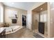 Spa-like bathroom featuring a soaking tub, walk-in shower, and large closet at 3158 Biancavilla Ave, Henderson, NV 89044