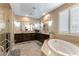 Spacious bathroom with a corner soaking tub and double vanity at 3158 Biancavilla Ave, Henderson, NV 89044