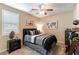 Guest bedroom with a full-size bed and ceiling fan at 3158 Biancavilla Ave, Henderson, NV 89044