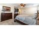 Primary bedroom with large dresser and TV at 3158 Biancavilla Ave, Henderson, NV 89044