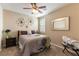 Cozy bedroom with a queen-size bed and ceiling fan at 3158 Biancavilla Ave, Henderson, NV 89044