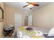 Bright bedroom with a floral bedspread and ceiling fan at 3158 Biancavilla Ave, Henderson, NV 89044