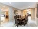 Spacious dining room with a view into the kitchen and adjacent office at 3158 Biancavilla Ave, Henderson, NV 89044