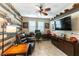 Home office features wood-paneled accent wall, built-in shelving, and comfortable seating at 3158 Biancavilla Ave, Henderson, NV 89044