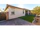 Home exterior showcasing a backyard with artificial turf and brickwork at 3158 Biancavilla Ave, Henderson, NV 89044