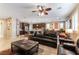 Open concept kitchen with island, stainless steel appliances, and dark wood cabinets at 3158 Biancavilla Ave, Henderson, NV 89044