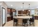 Large kitchen island with seating and a built-in sink at 3158 Biancavilla Ave, Henderson, NV 89044