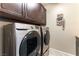 Laundry room with washer, dryer, and upper cabinets at 3158 Biancavilla Ave, Henderson, NV 89044