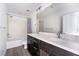 Modern bathroom with double vanity, bathtub, and gray accents at 358 Terrill Ave, Las Vegas, NV 89183