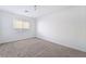 Well-lit bedroom featuring neutral carpeting and large window at 358 Terrill Ave, Las Vegas, NV 89183