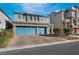 Three-car garage, stone accents, and landscaping highlight this inviting home exterior at 358 Terrill Ave, Las Vegas, NV 89183