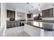 Modern kitchen with dark cabinetry, granite counters, and large island at 358 Terrill Ave, Las Vegas, NV 89183