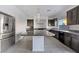 Modern kitchen with dark cabinetry, granite counters, and large island at 358 Terrill Ave, Las Vegas, NV 89183