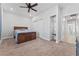 Bright bedroom with carpeted floor, ceiling fan, and built-in shelving at 3720 W Charleston Park Ave, Pahrump, NV 89048