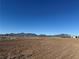 Vast empty lot with mountain views in the background at 3720 W Charleston Park Ave, Pahrump, NV 89048