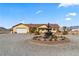 Single-story home with a fountain and landscaped yard at 3720 W Charleston Park Ave, Pahrump, NV 89048